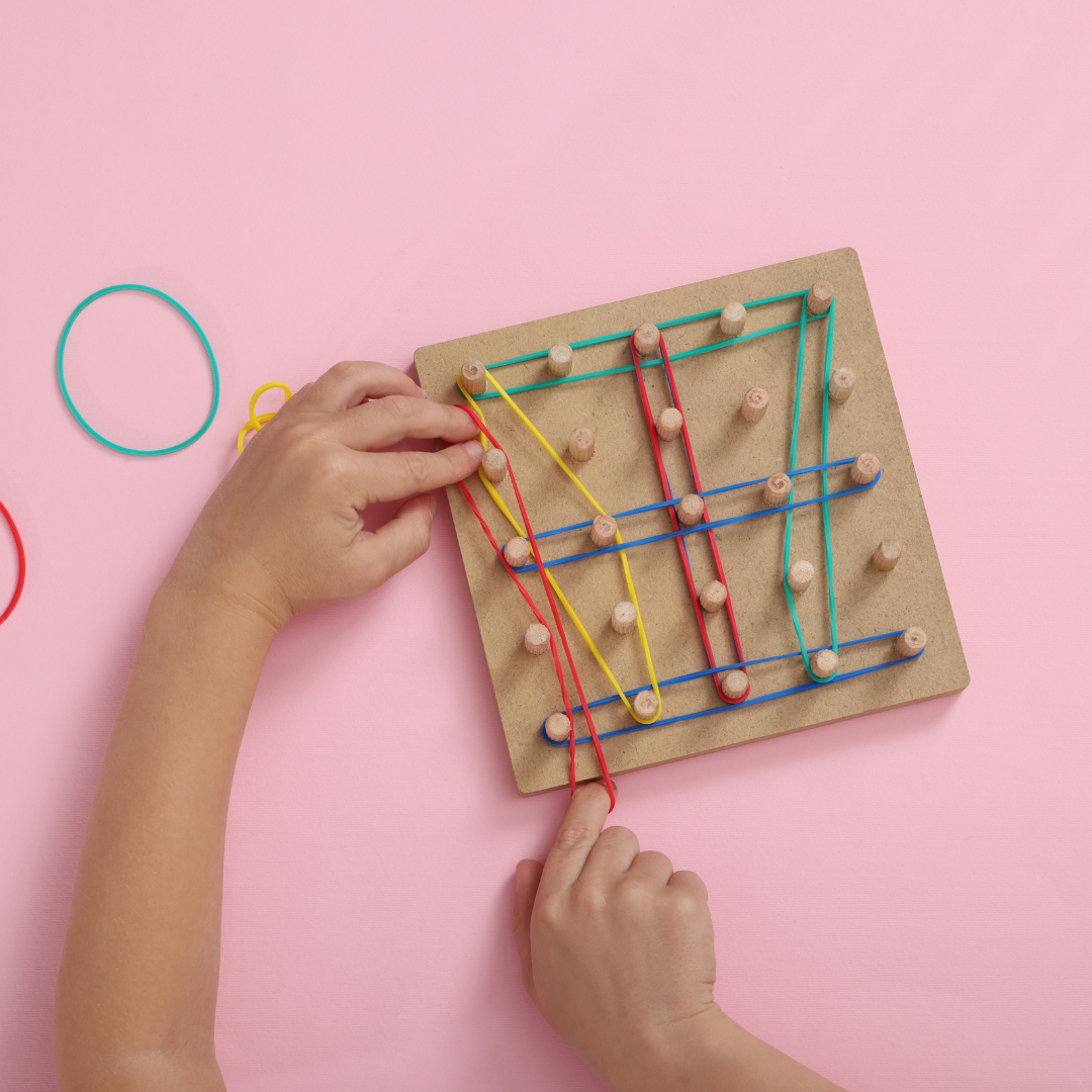 Puzzle with pegs and elastic bands on a board to represent skill